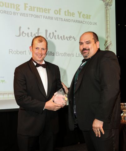 Robert Wills pictured receiving his award from Rob Drysdale, Director of Westpoint Veterinary Group